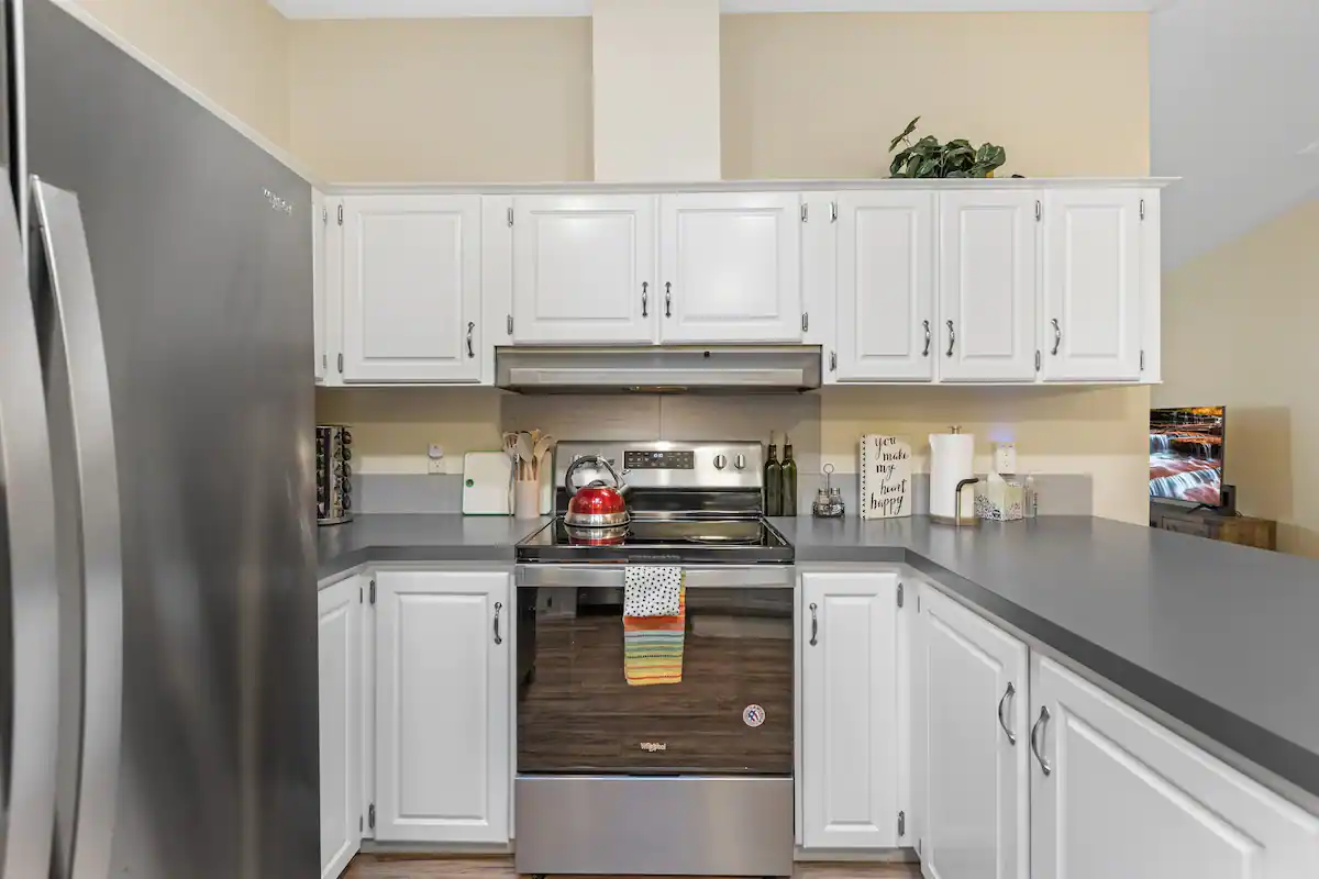 Kitchen with stainless steel appliances and full spice rack